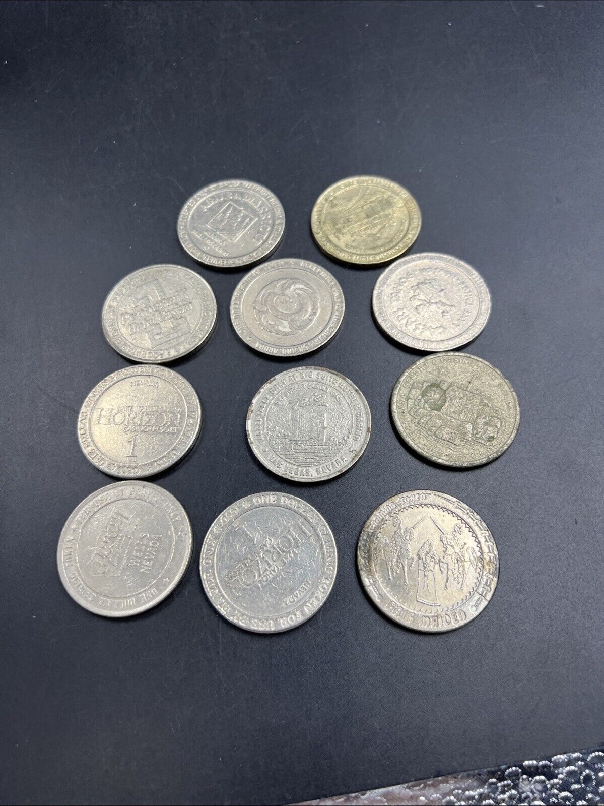 Lot of 11 $1 Casino Gaming Tokens Metal Very Circulated Conditions