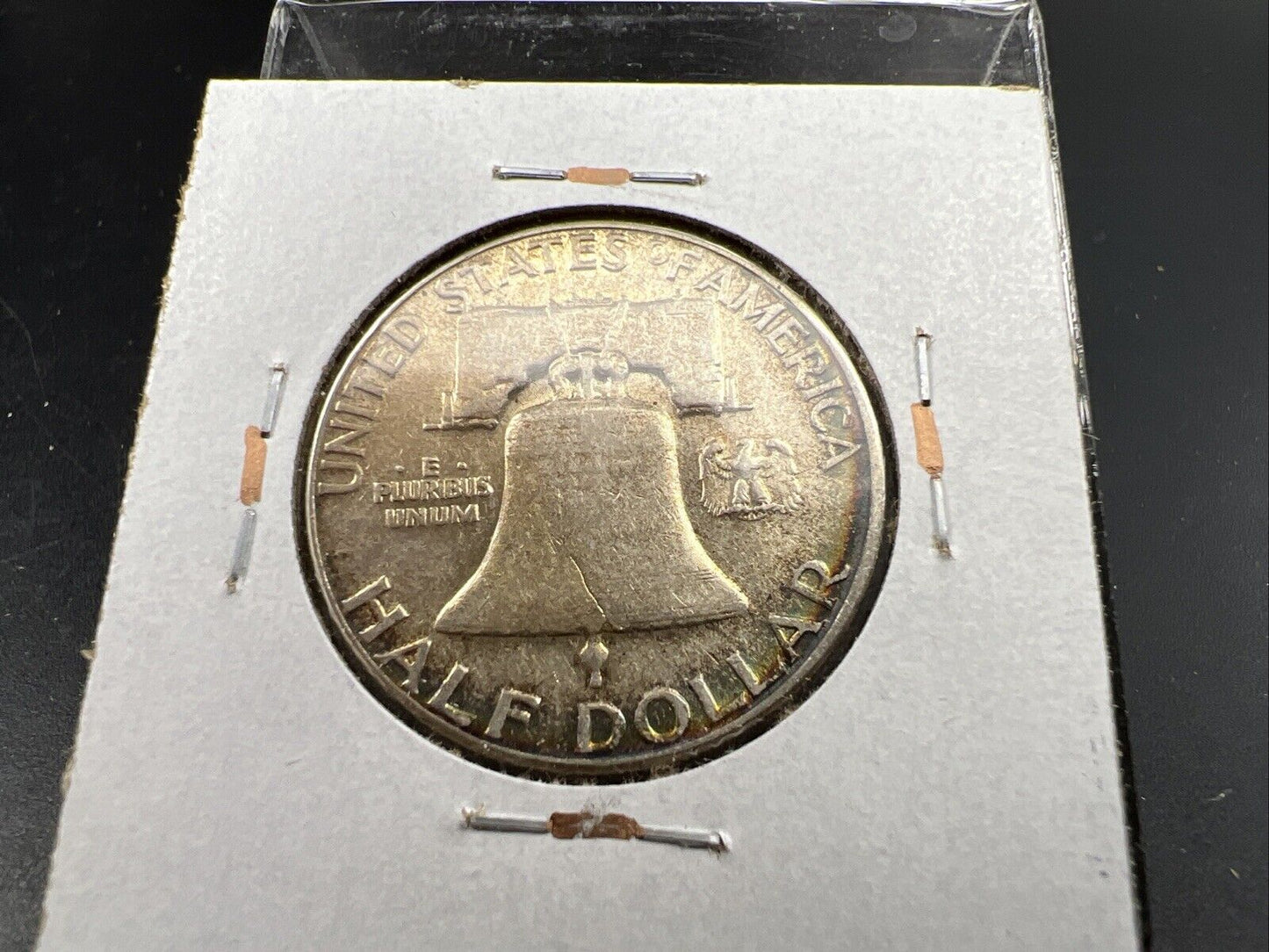 1957 P Franklin Half Dollar Rainbow Toning Obverse VF Very Fine Circulated