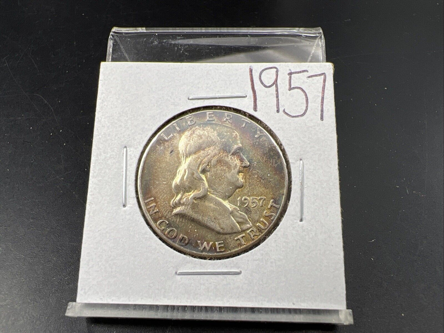 1957 P Franklin Half Dollar Rainbow Toning Obverse VF Very Fine Circulated