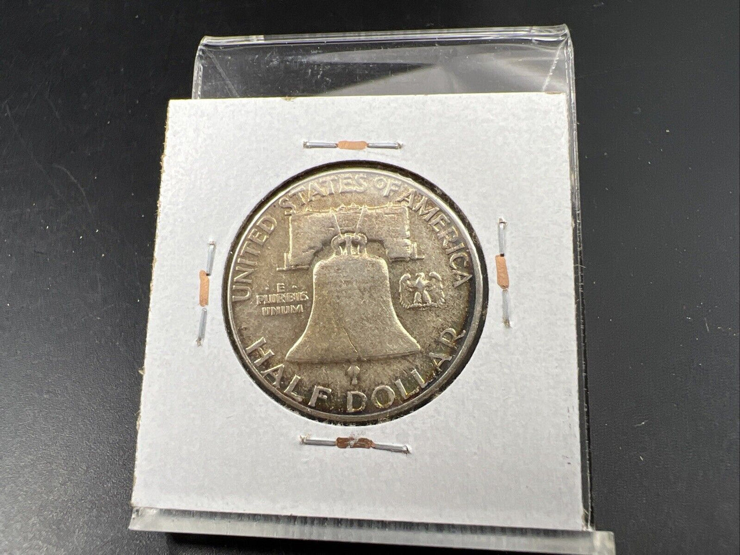 1957 P Franklin Half Dollar Rainbow Toning Obverse VF Very Fine Circulated