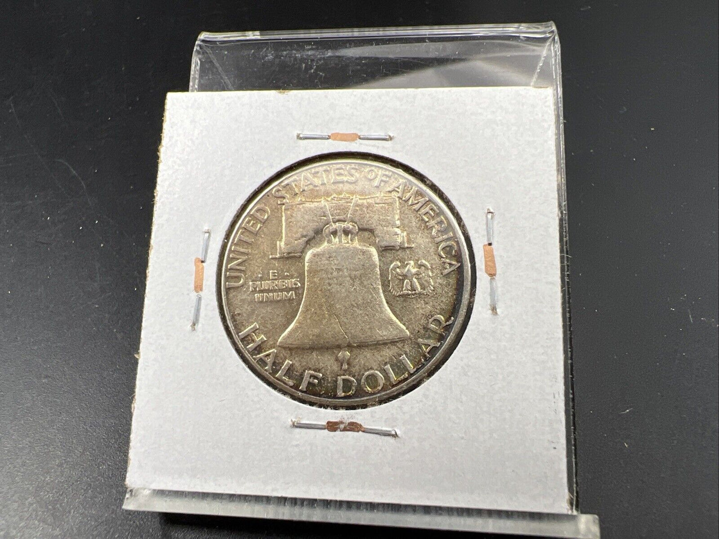 1957 P Franklin Half Dollar Rainbow Toning Obverse VF Very Fine Circulated