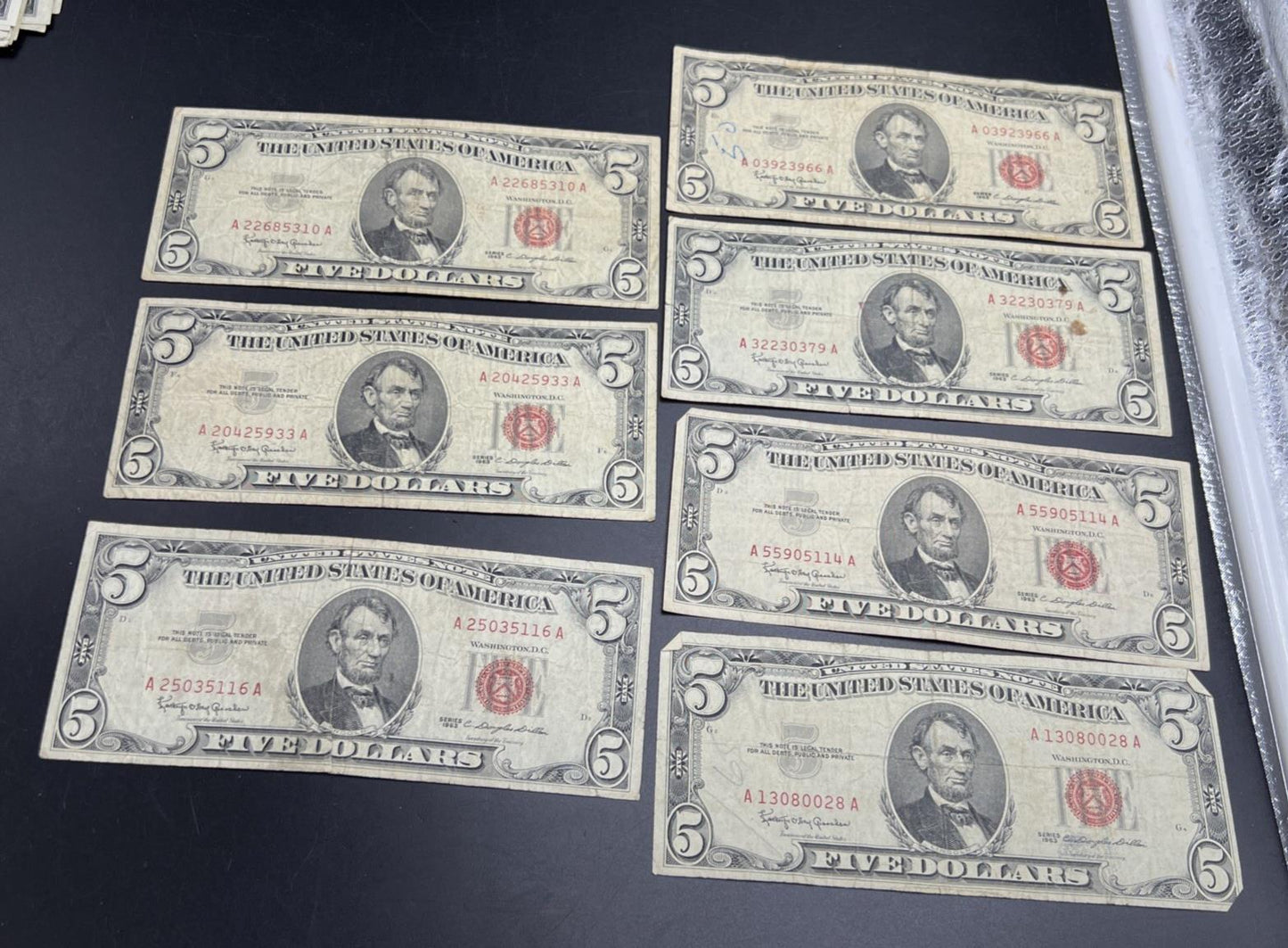 Lot of 7 1963 $5 Legal Tender United States Notes Red Seals Very circulated #116