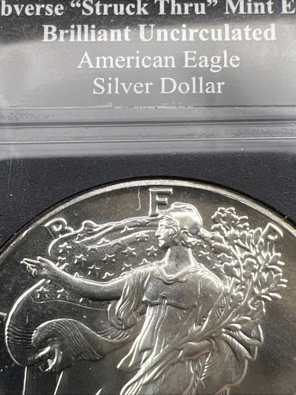 1989 1 Oz ASE American Silver Eagle Coin Obverse Struck Thru Error