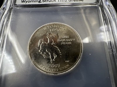 2007 P 25c Wyoming Quarter Coin Struck Thru Grease Error ICG BU #105