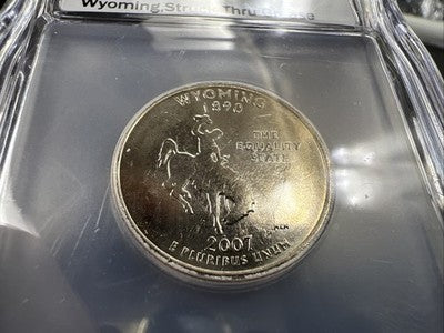 2007 P 25c Wyoming Quarter Coin Struck Thru Grease Error ICG BU #105