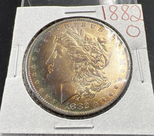 1882 O $1 Morgan Silver Dollar Coin Choice AU About UNC Rainbow Toning Obverse