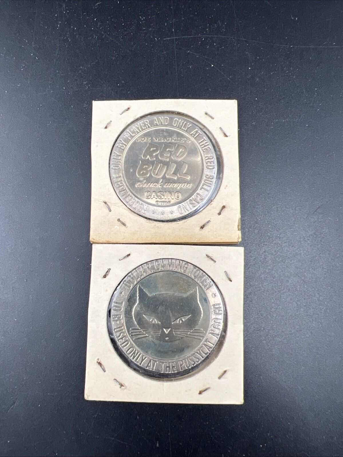 Lot o 2 Specimine Proof Strike Casino Tokens Red Bull Casino & Pussycat A' Go Go