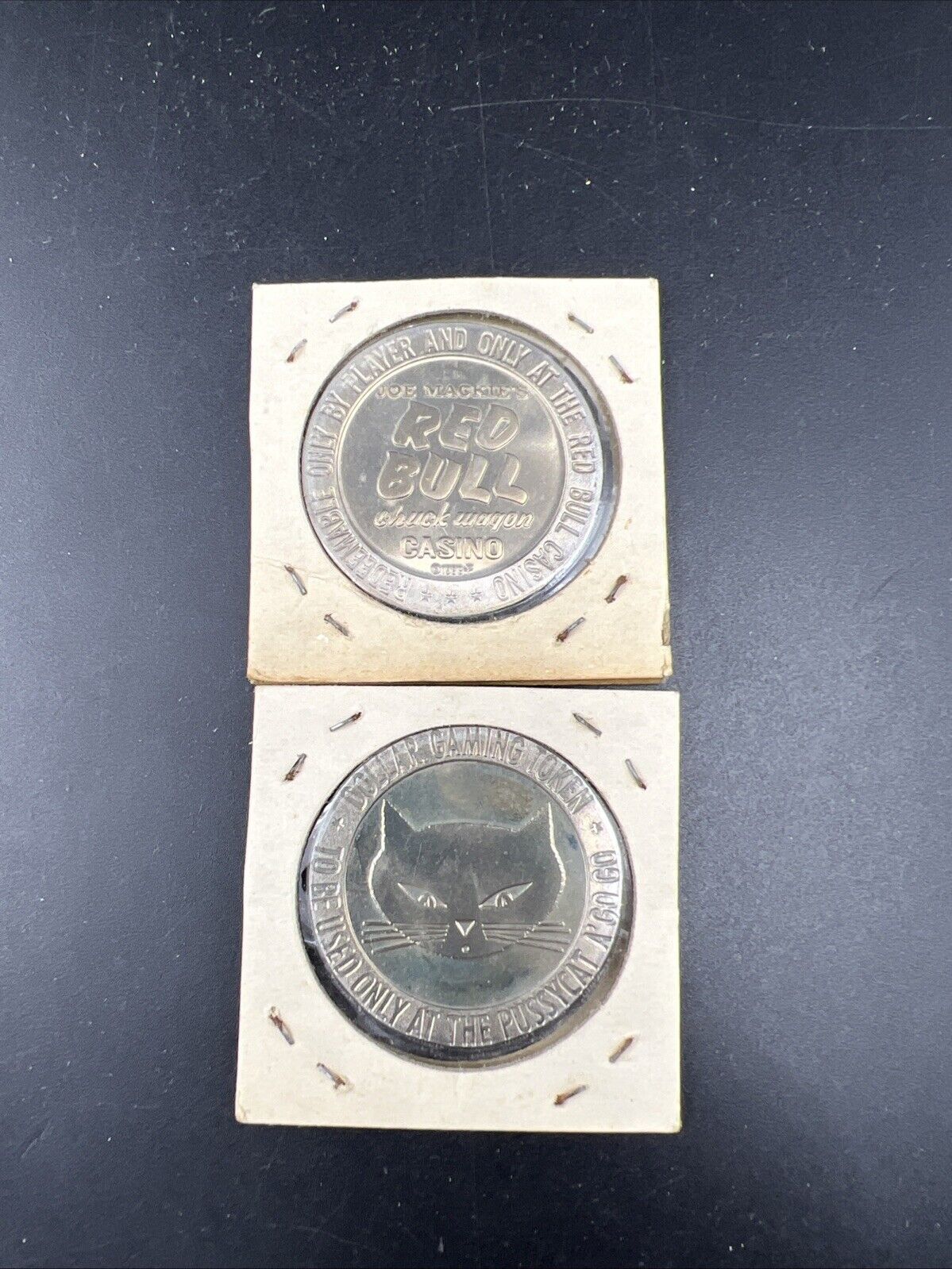 Lot o 2 Specimine Proof Strike Casino Tokens Red Bull Casino & Pussycat A' Go Go