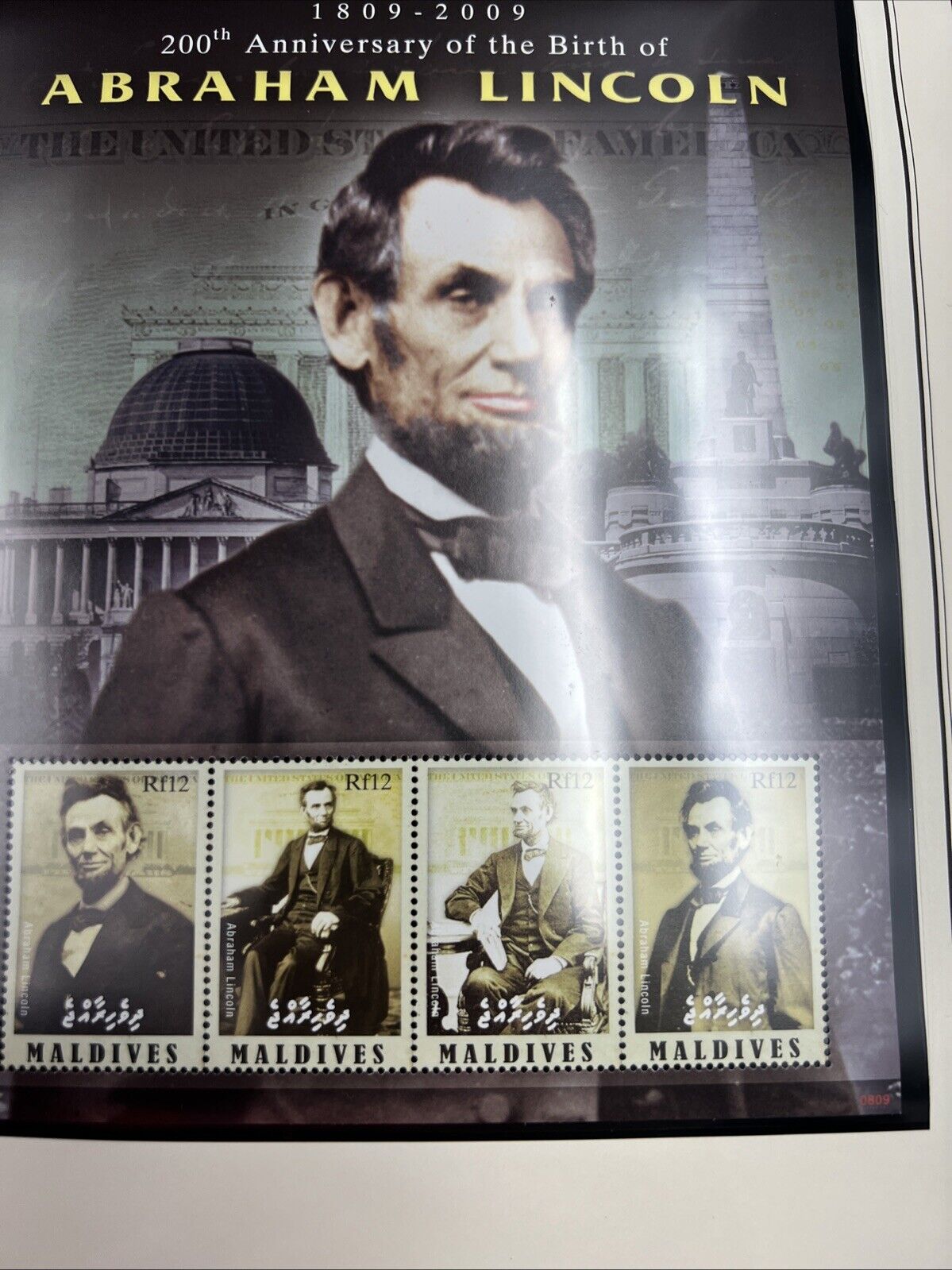 The Abraham Lincoln Coin and Stamp Collection set with Silver Dollar Stamps +