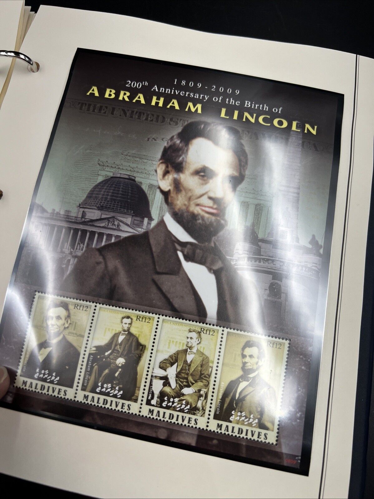 The Abraham Lincoln Coin and Stamp Collection set with Silver Dollar Stamps +