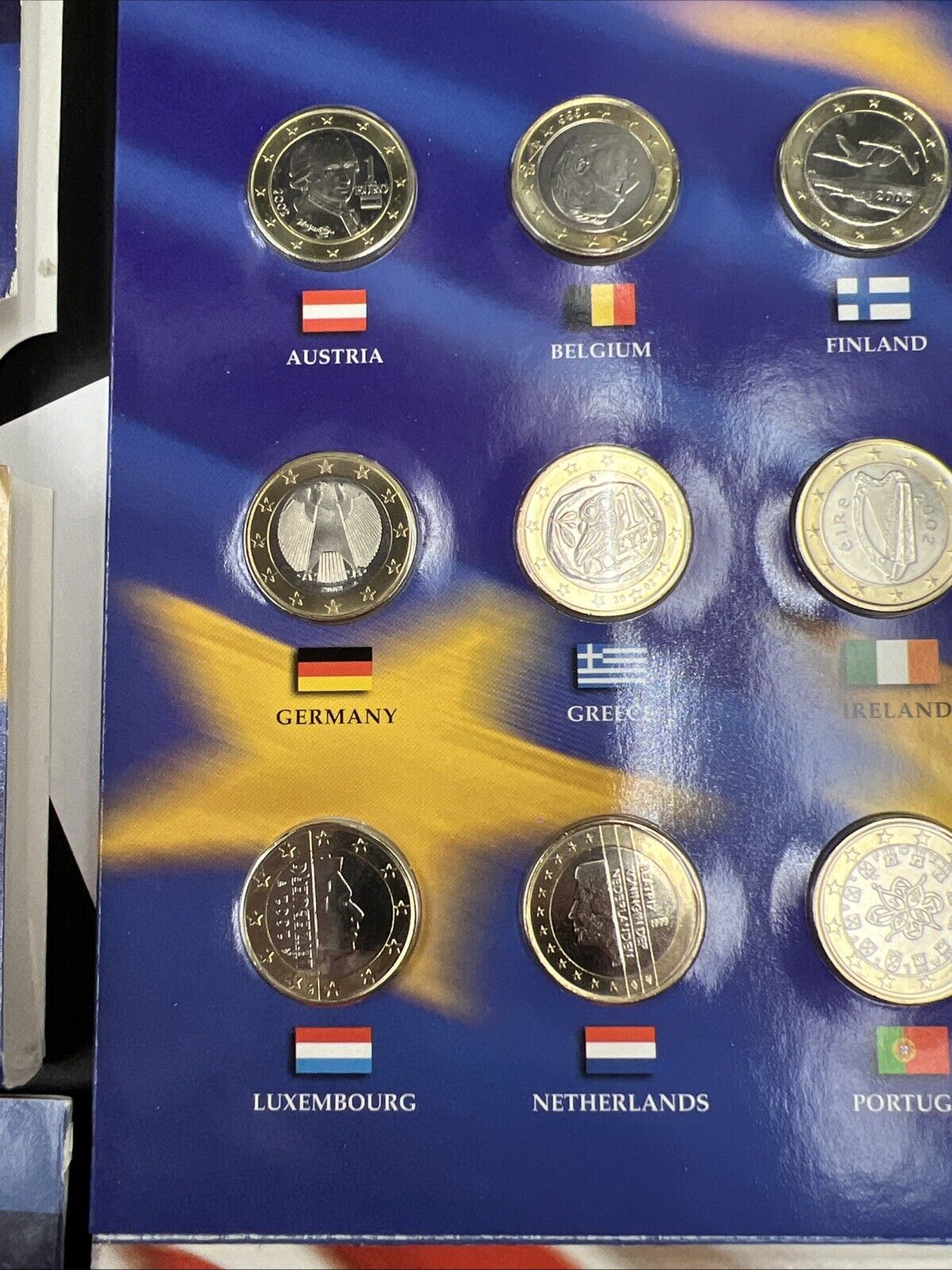 The 50 State Quarters & Euro Coin Collection 5 2002 BU QTRs + 12 BU Euro Coins