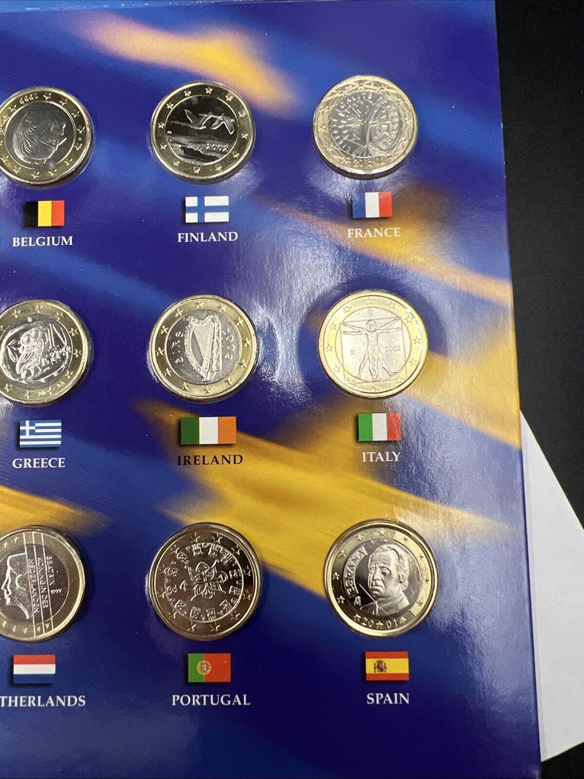 The 50 State Quarters & Euro Coin Collection 5 2002 BU QTRs + 12 BU Euro Coins