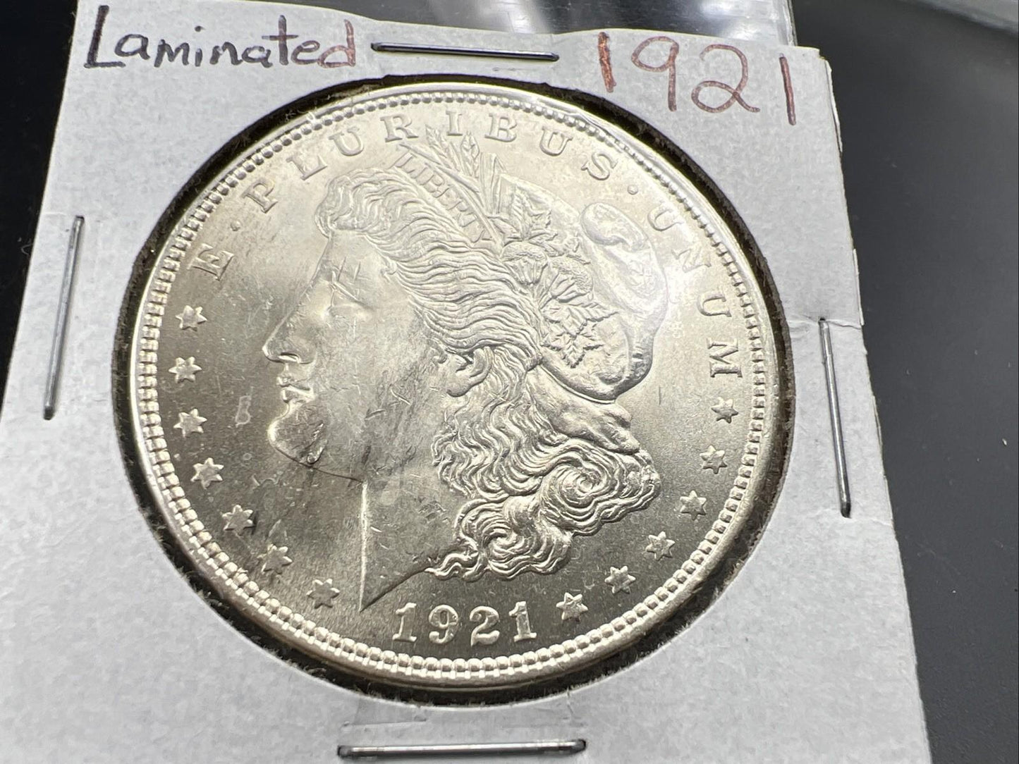 1921 P $1 Morgan Silver Dollar Error Coin Laminated Planchet Obverse UNC Details