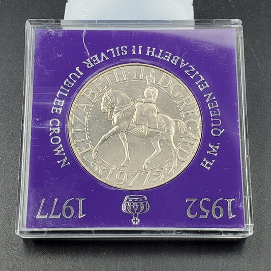 1952-1977 QUEEN  ELIZABETH II SILVER JUBILEE COMMEMORATIVE CROWN, PURPLE CASE